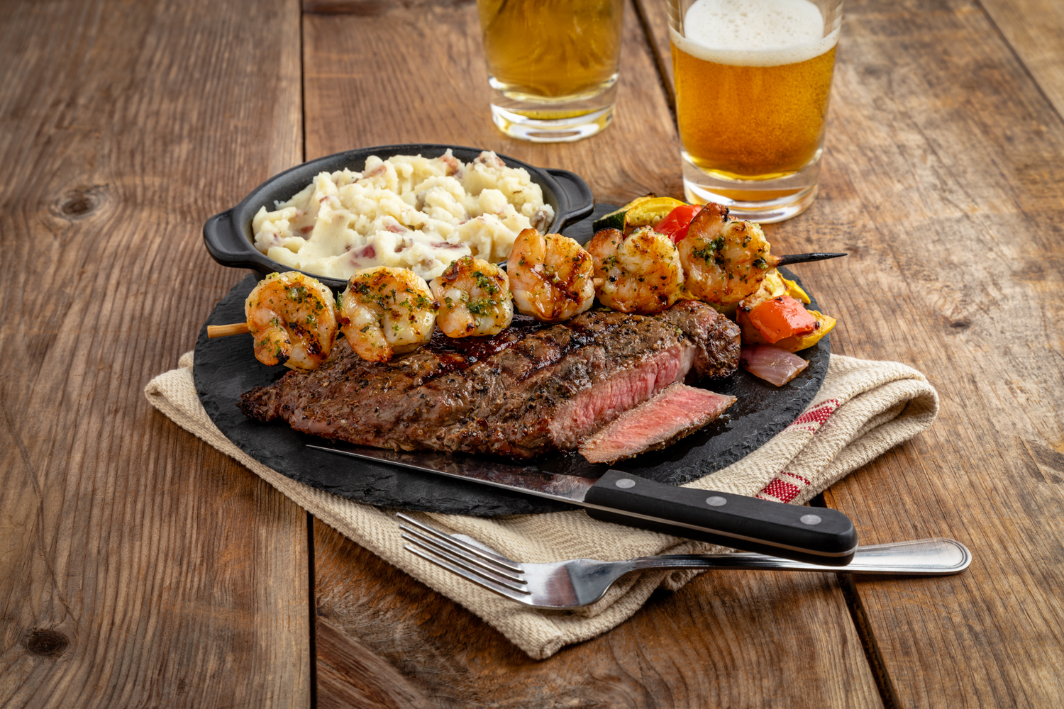 CAJUN RIBEYE AND GRILLED SHRIMP