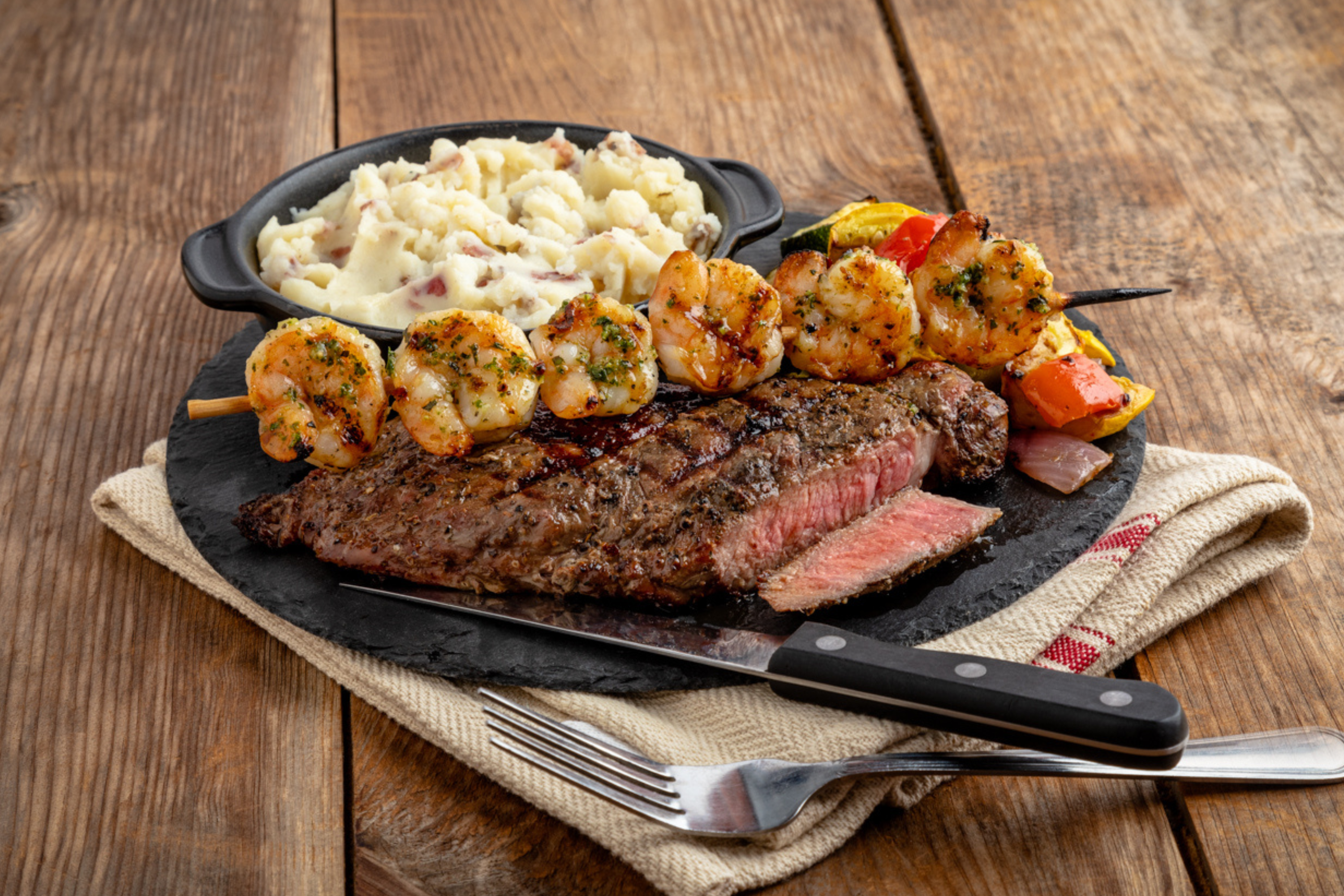 CHICAGO SEASONED RIBEYE* AND GRILLED SHRIMP SKEWER